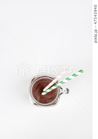 Sports nutrition with chocolate protein shake, top view. Copy space 47543940