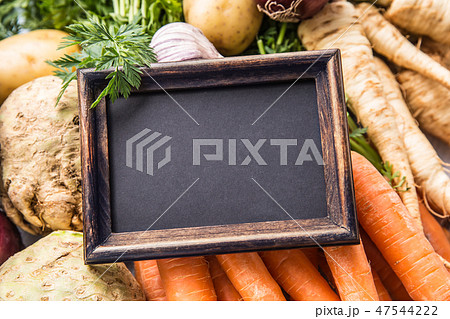 Top of view empty chalkboard on fresh vegetables. 47544222