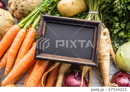 Top of view empty chalkboard on fresh vegetables. 47544223
