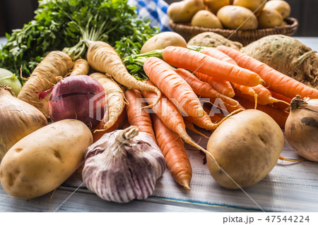 Assortment of fresh vegetables on wooden table. Assortment of fresh vegetables on wooden table. 47544224