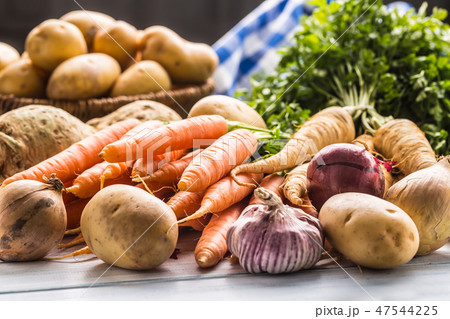 Assortment of fresh vegetables on wooden table. Assortment of fresh vegetables on wooden table. 47544225