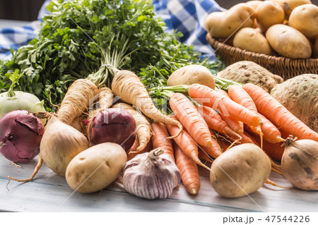 Assortment of fresh vegetables on wooden table. Assortment of fresh vegetables on wooden table. 47544226
