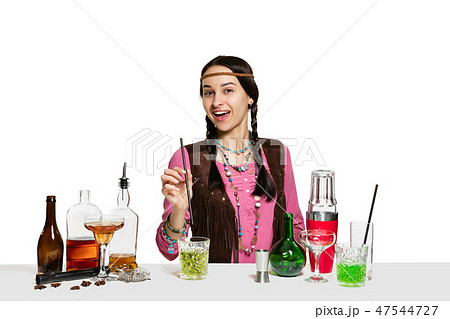 Expert female barman is making cocktail at studio 47544727