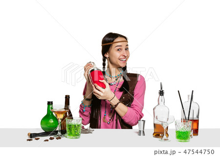 Expert female barman is making cocktail at studio 47544750