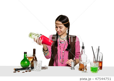 Expert female barman is making cocktail at studio 47544751