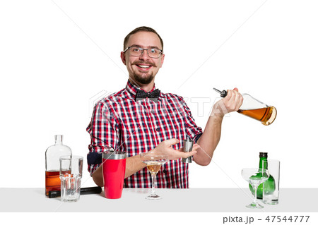 Expert barman is making cocktail at studio Expert barman is making cocktail at studio 47544777