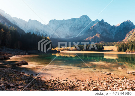 Colorful sunrise on Fusine lake 47544980