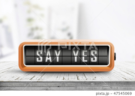 Say yes message sign on a wooden desk 47545069