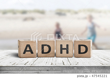 ADHD sign on a wooden table with kids ADHD sign on a wooden table with kids 47545221