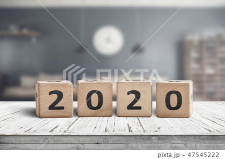 Year 2020 sign on a wooden desk in a cozy kitchen Year 2020 sign on a wooden desk in a cozy kitchen 47545222
