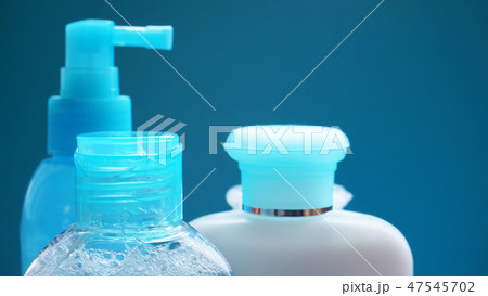 Blue cosmetic tube on blue background. Blank plastic container, packaging design 47545702