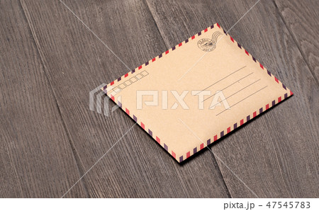 Envelope on a wooden background Envelope on a wooden background 47545783