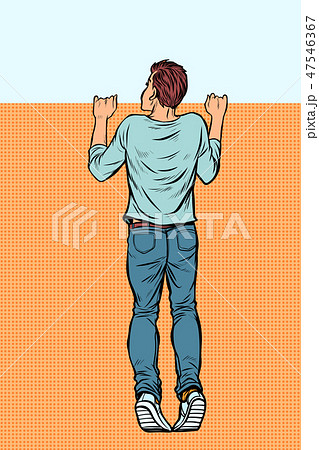 young man looks over the fence young man looks over the fence 47546367