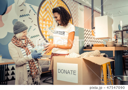 Positive afro American woman giving a nice gift 47547090