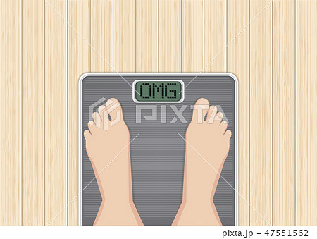 Feet on scales, Wooden desk background 47551562