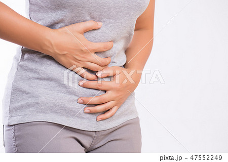 Young woman having painful stomachache. 47552249