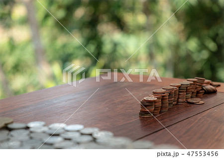 Thai Baht coins 25 Satang lots on wooden table 47553456