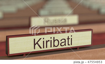 Kiribati name sign among different countries plaques at international organization. 3D rendering 47554953