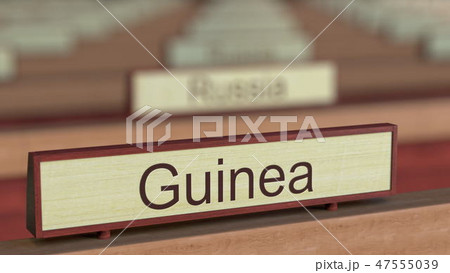 Guinea name sign among different countries plaques at international organization. 3D rendering Guinea name sign among different countries plaques at international organization. 3D rendering 47555039