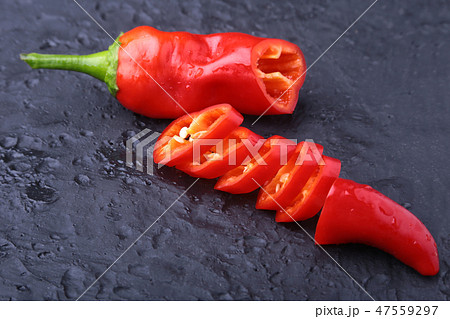 CloseUp top view red chili pepper with sliced, raw food ingredient concept 47559297