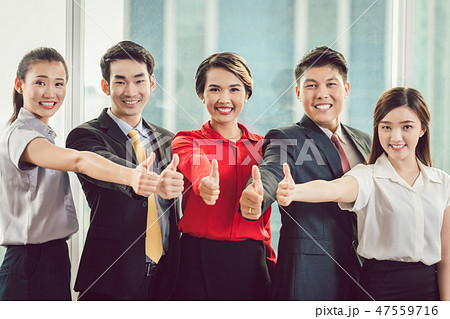 Businesspeople showing thumb up sign 47559716