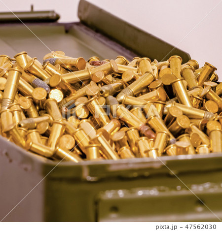 Metal container heaping with some shiny ammunition 47562030