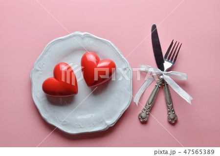 Red rose on white dish.Concept of Valentine's Day. 47565389