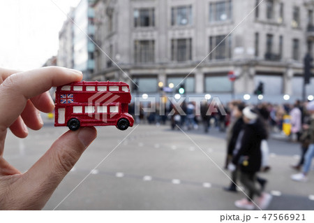 man with a londoner red double-decker bus 47566921