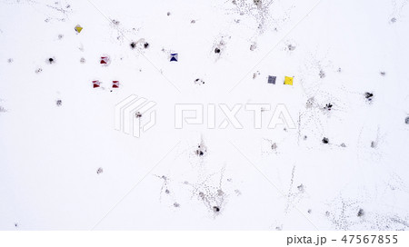 Aerial view of winter fishing. Fishermen set up tents for fishing at night. Aerial view of winter fishing. Fishermen set up tents for fishing at night. 47567855
