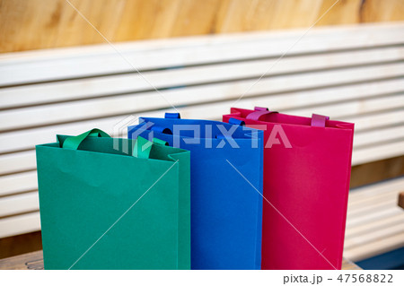 Paper bags for shopping. Sale concept on wooden background 47568822