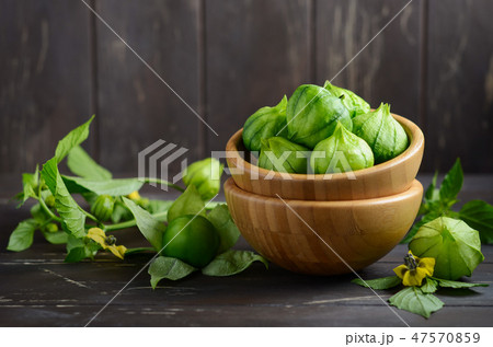 Fresh organic green tomatillos. 47570859