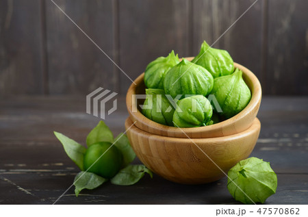 Fresh organic green tomatillos. 47570862