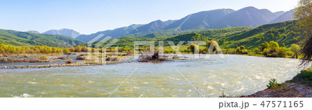Panorama of a mountain valley with a river 47571165