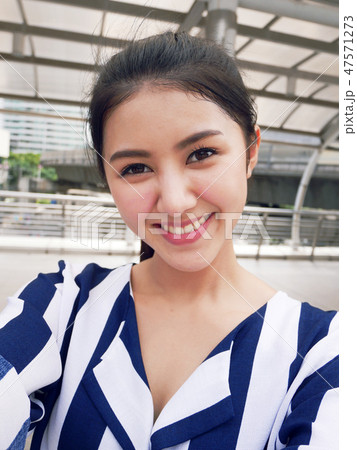 Beautiful woman take photo selfie and traveling. 47571273