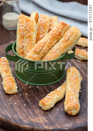 Homemade savory bread sticks with cheese, sesame 47571587