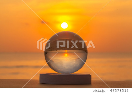 sunset inside the crystal ball on the beach 47573515