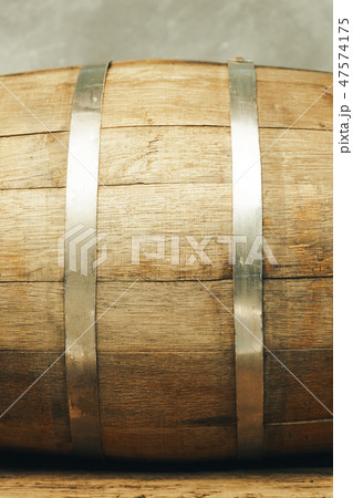 Wooden barrel and worn old table of wood. Wooden barrel and worn old table of wood. 47574175