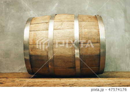 Wooden barrel and worn old table of wood. Wooden barrel and worn old table of wood. 47574176
