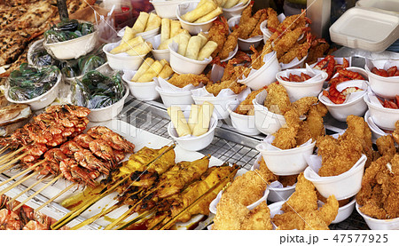 Street food stall with assortment of snacks. 47577925