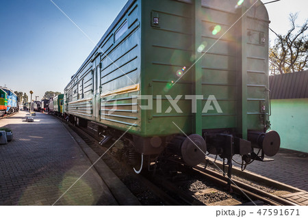 locomotive stands on the platform of the station. 47591671
