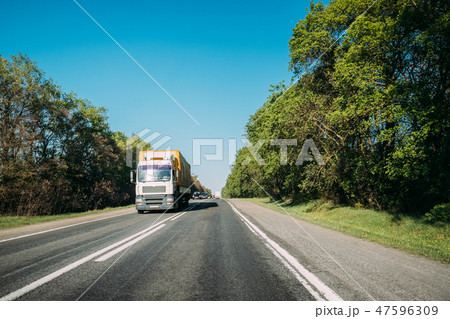 Truck On Country Road. Tractor Unit, Prime Mover, Traction Unit In Motion On Countryside Road In 47596309