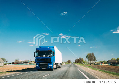 Truck On Country Road. Tractor Unit, Prime Mover, Traction Unit In Motion On Countryside Road In 47596315