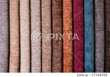Colorful and bright fabric samples of furniture and clothing upholstery. Close-up of a palette of 47598568