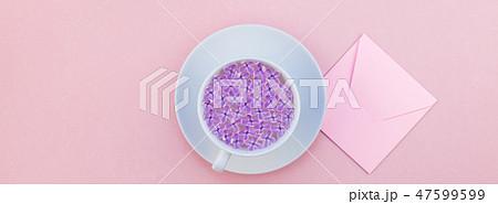 Cup of beautiful lilac flowers infused water Cup of beautiful lilac flowers infused water 47599599