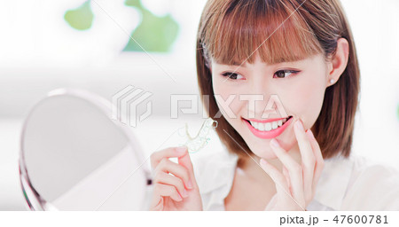 woman with retainer for teeth woman with retainer for teeth 47600781