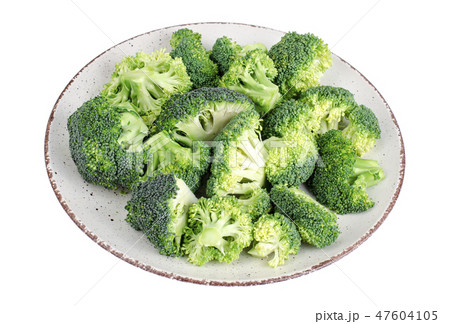 Plate with chopped broccoli buds isolated  47604105
