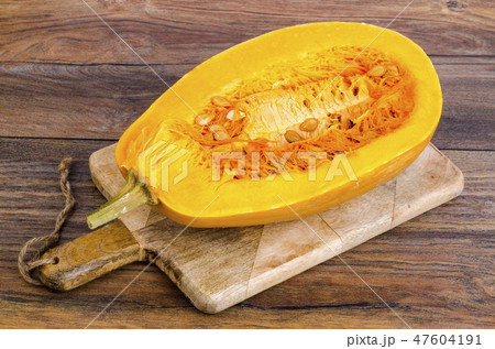 Sliced ripe pumpkin on wooden table Sliced ripe pumpkin on wooden table 47604191