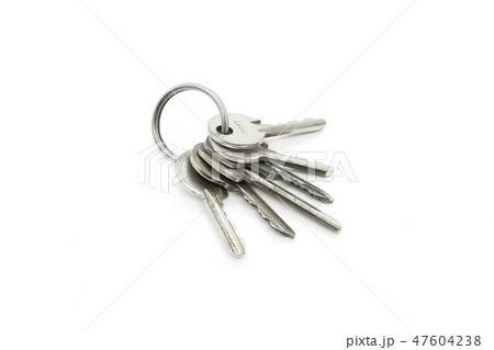 Silver keys on the ring on white background 47604238