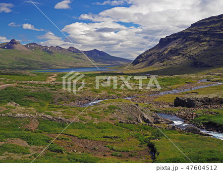wonderful river valley with eroded mountains in west Iceland 47604512