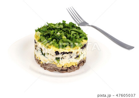 Portion salad with tongue on white plate Portion salad with tongue on white plate 47605037